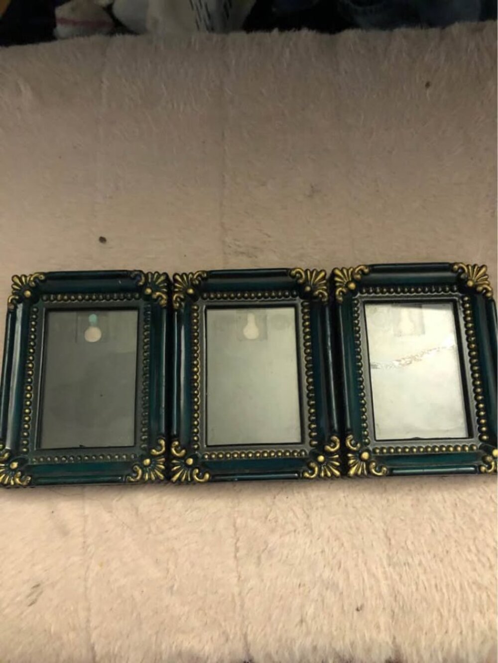Vintage Victorian-style triple picture frame featuring decorative acanthus